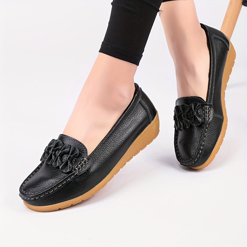 Women's flat shoes with bow detail, solid color, round toe, slip-on design for casual walking.