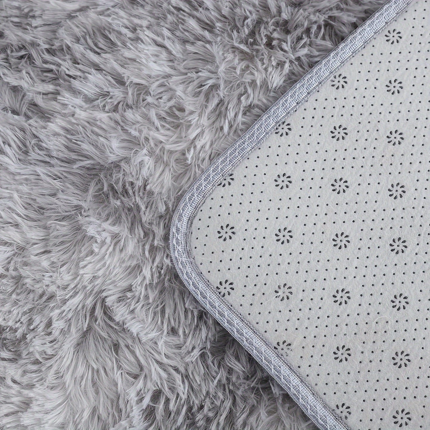 Large round area rug made of soft plush shaggy material, featuring a non-slip and waterproof design. This polyester fiber rug can be hand washed and is perfect for adding a cozy touch to your living room, bedroom, nursery, game room, dorm, or teen room