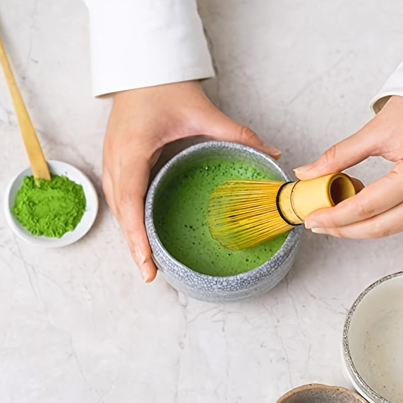 A set of 4 Japanese Matcha Ritual Accessories, including a Momonri Traditional Spoon, Tea Spoon, Matcha Egg Beater, and other accessories. This perfect set is ideal for preparing traditional Matcha. The set features a natural bamboo tea egg beater in