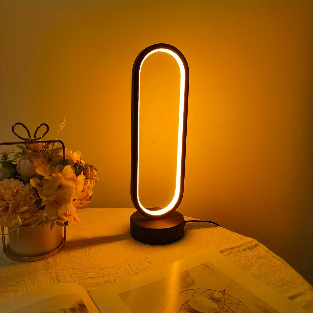 USB-powered LED ring table lamp in black or white; dimmable for bedroom and living room decor.