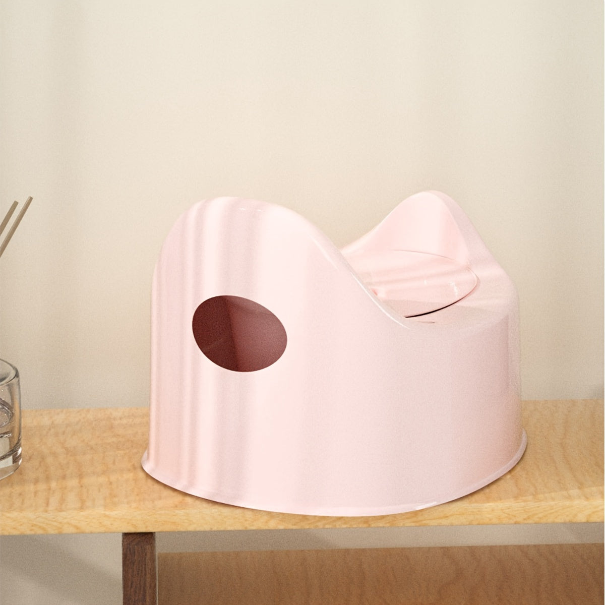 Heart-shaped potty training seat designed for children aged 0-3 years, featuring easy-clean durable PP material. Available in white, pink, or blue colors with a urine bucket for toilet training and promoting independence.