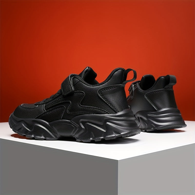 Black boys' footwear with water-resistant, hook-and-loop strap, and soft EVA sole - versatile for running.