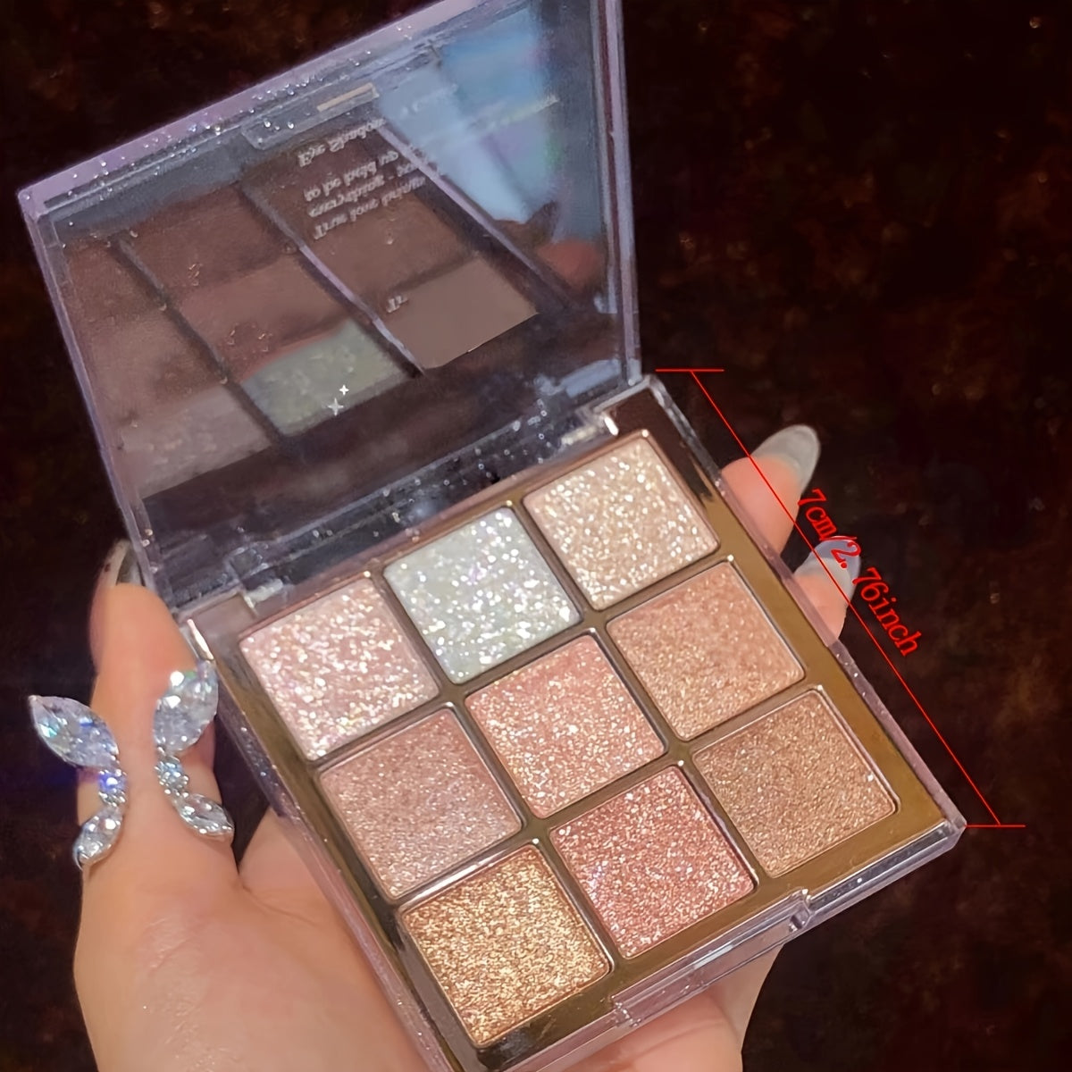 9-color eyeshadow palette with shimmery and matte finishes in brown and multicolor tones for daily and party looks, including glitter shades.