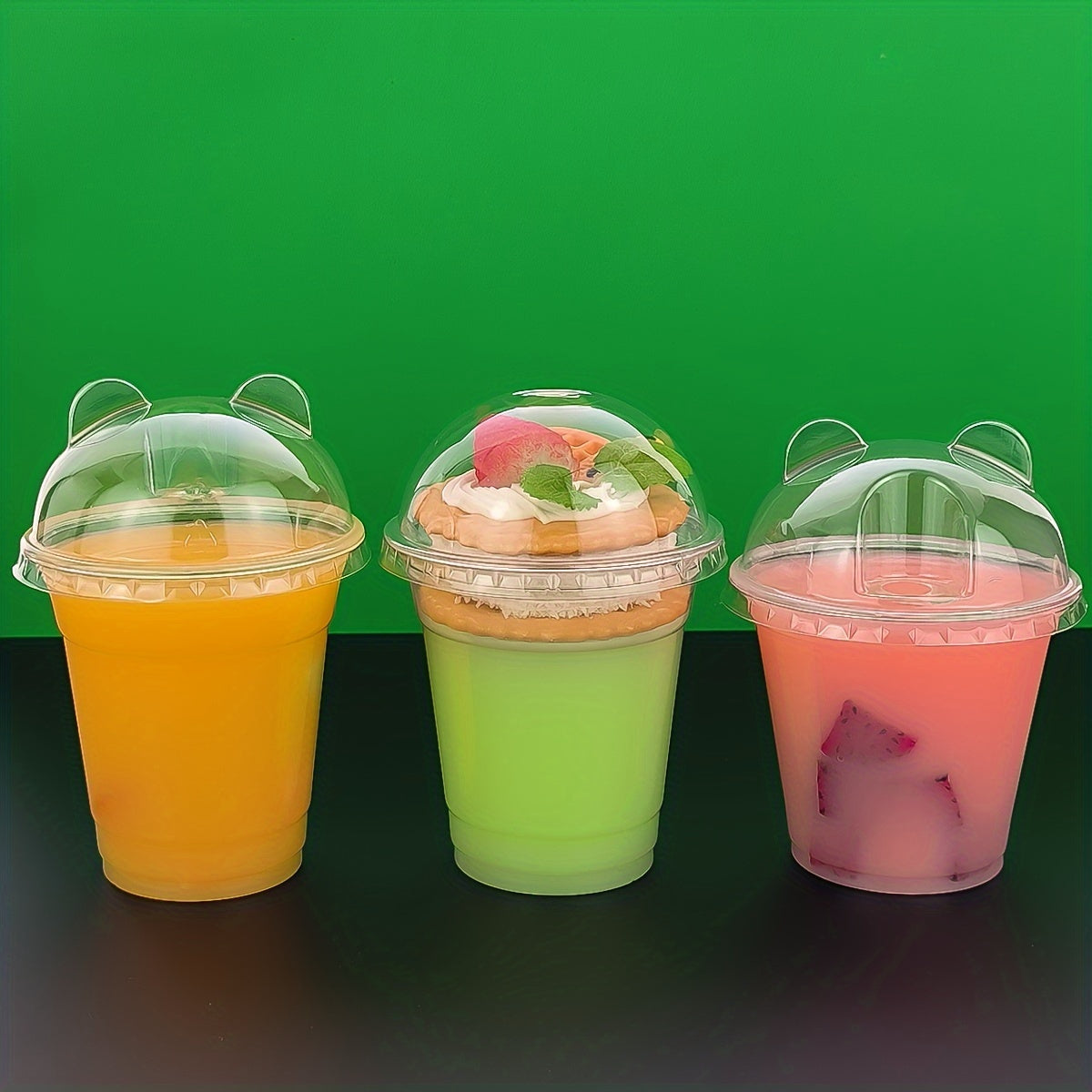 50 pieces of transparent plastic cups with lids, each holding 9oz to 10oz. Perfect for festivals, parties, serving cold drinks, desserts, and coffee. Essential party supplies for any occasion. Add these drinkware accessories to your collection!