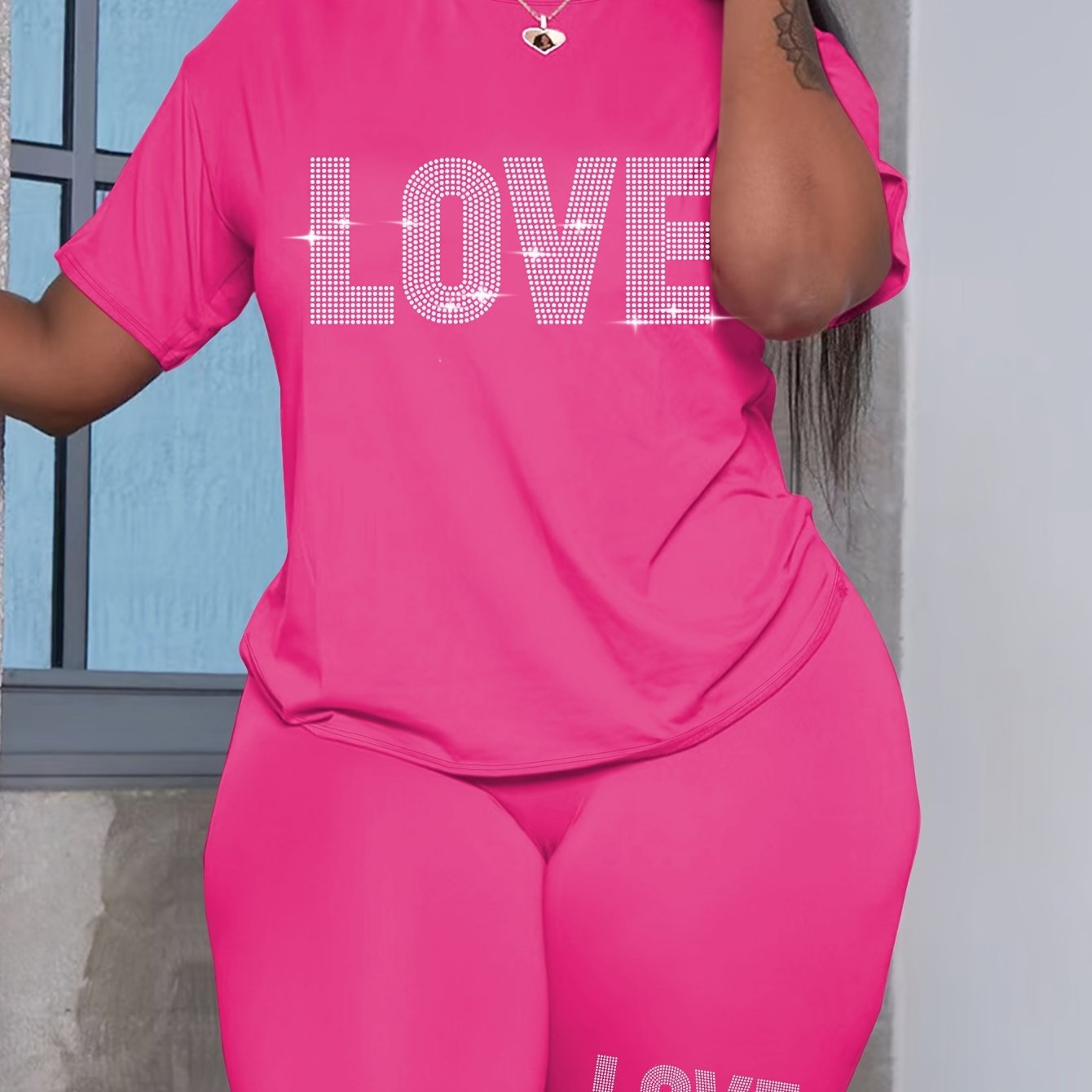 Plus-size women's casual polyester T-shirt and shorts set with alphabet love print, ideal for daily wear.