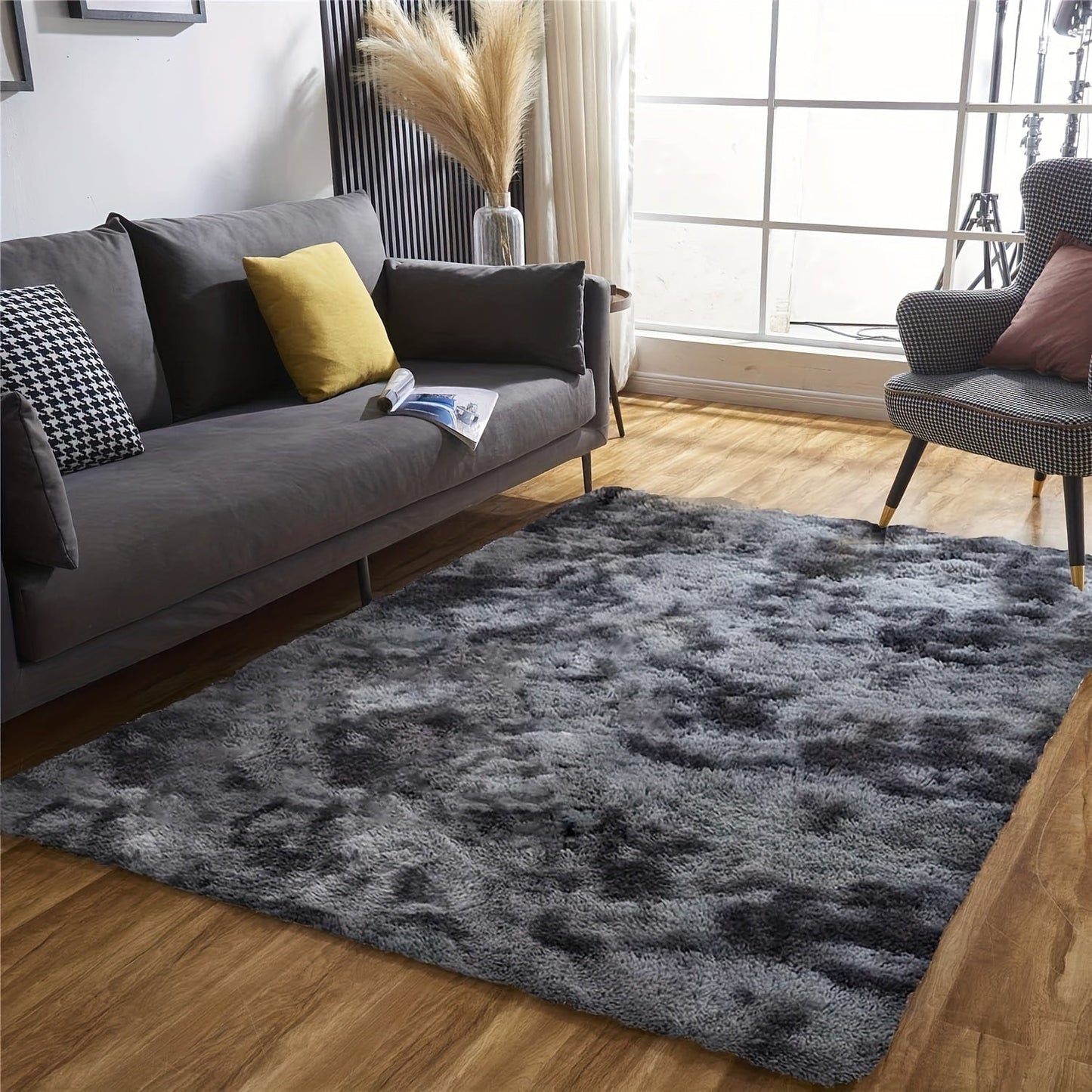 Luxurious Soft Faux Fur Area Rug in Modern Deep Grey Shaggy Design, Perfect for Living Room or Bedroom Decor. Made of Ultra Soft Polyester Material, Dry Clean Only. Available in Various Sizes.