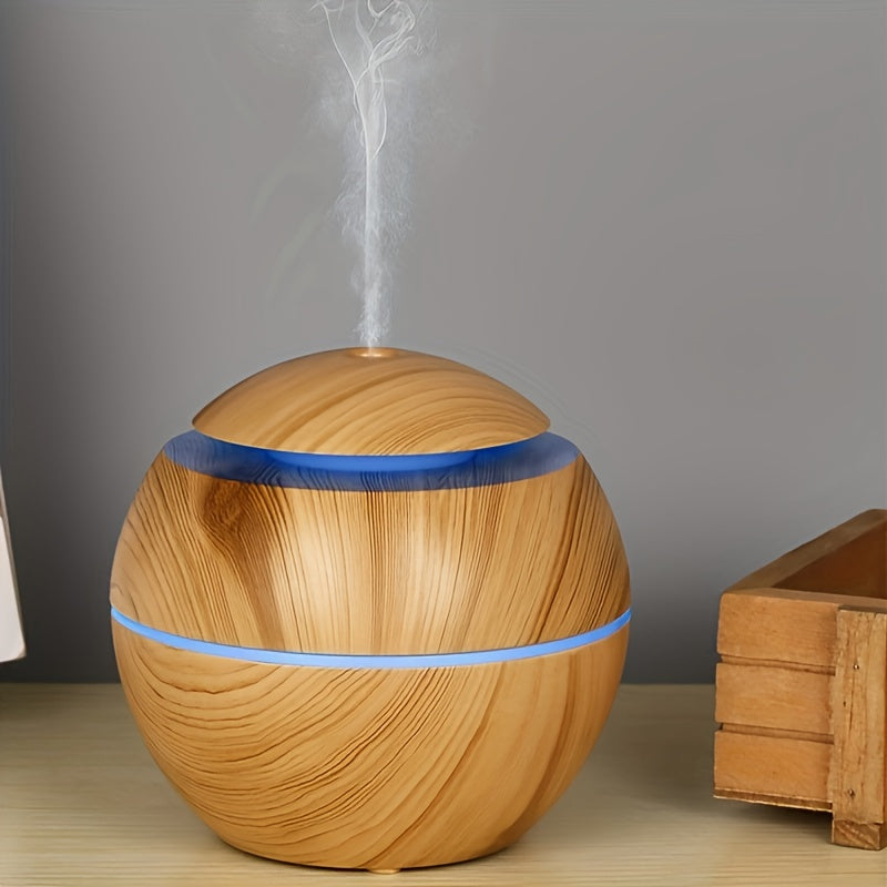 Quiet USB-powered cold mist humidifier and essential oil diffuser, ideal for bedroom, office, living room, and travel during winter and autumn. Portable and easy to clean.