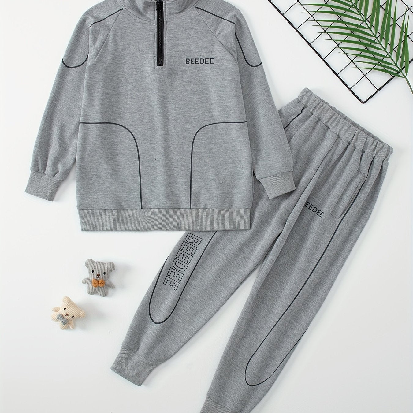 Boys' casual sportswear set includes zip-up jacket, joggers, and long sleeve shirt. Made of polyester, ideal for outdoor activities in spring and fall.