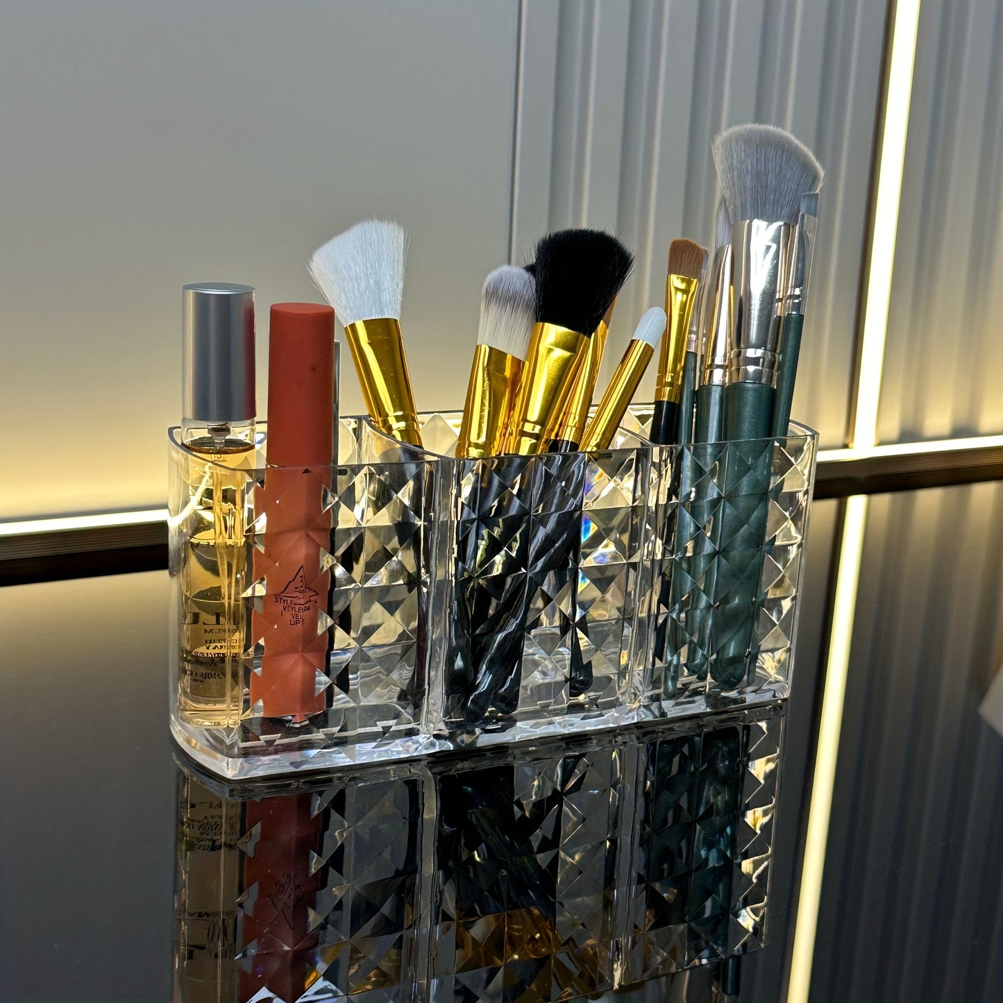 Premium acrylic makeup brush holder with 3 compartments for organizing brushes, ideal for bathroom decor and cosmetic storage.