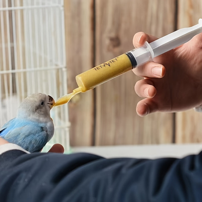 Parrot Milk Powder Feeding Tool Set for Young Tiger Peony Chicks with Syringe, Measuring Cup, and Spoon.