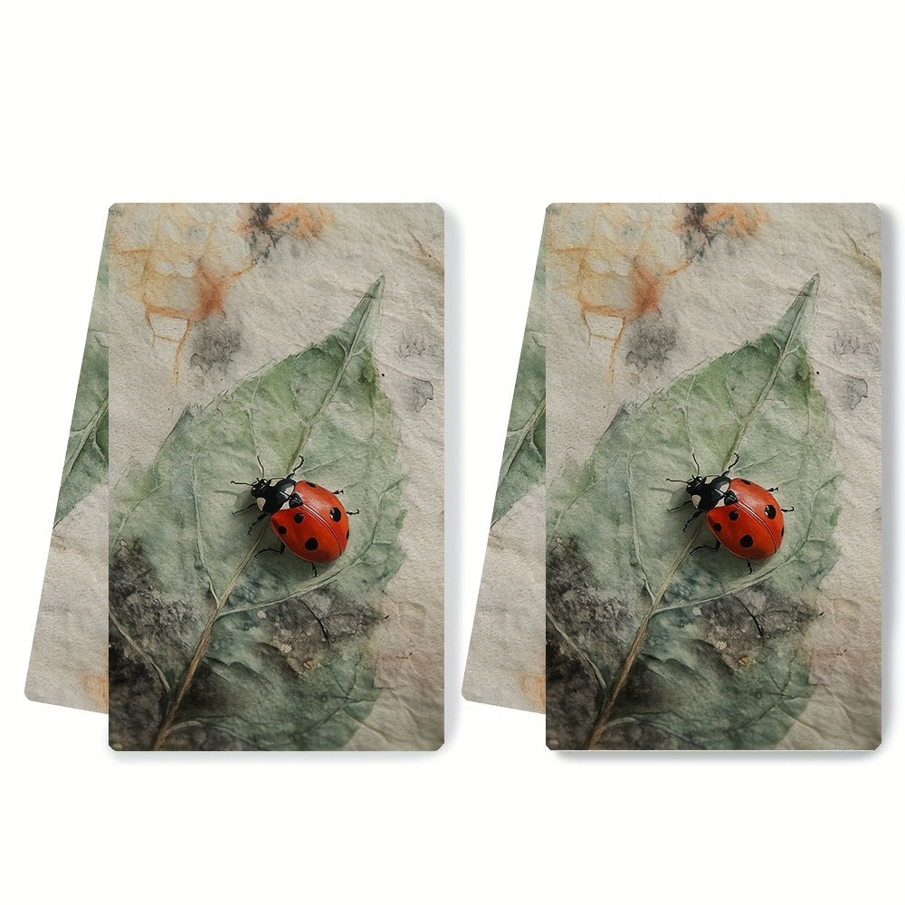 Two Coastal Style Ladybug Kitchen Towels made of highly absorbent polyester knit fabric. These machine washable hand towels are designed in a contemporary oblong shape, perfect for holiday decor. Each towel measures 40.64x60.96 cm and is ideal for drying