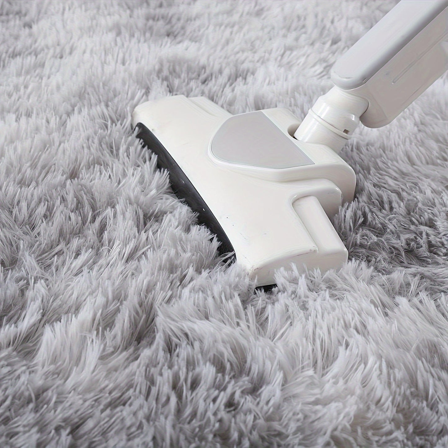 Indulge in the luxurious comfort of our Super Soft Fluffy Area Rug, crafted with non-slip plush polyester fiber for ultimate coziness. Ideal for enhancing the decor in your living room, bedroom, nursery, game room, or dorm. This rug is hand wash only and