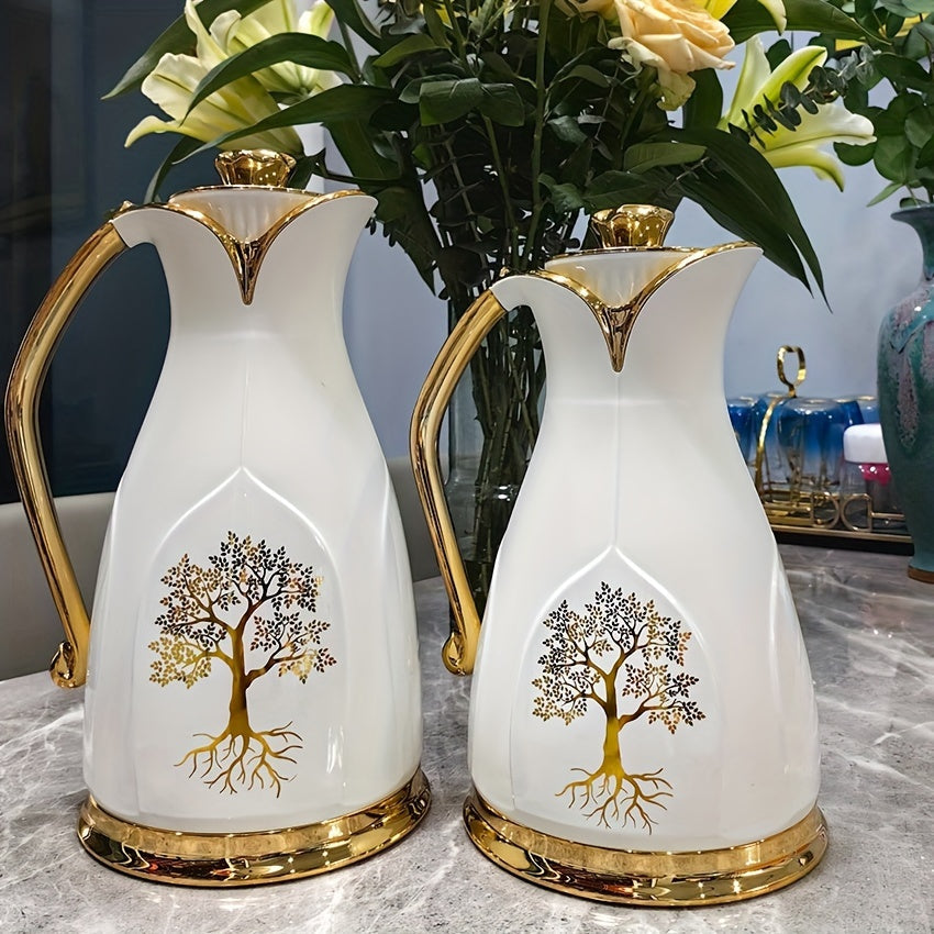 Beautiful insulated coffee carafe with a sleek double-walled design featuring a charming golden tree motif. This white ceramic thermal flask is vacuum sealed to keep beverages hot or cold. Perfect for tea and coffee lovers, this carafe is a must-have