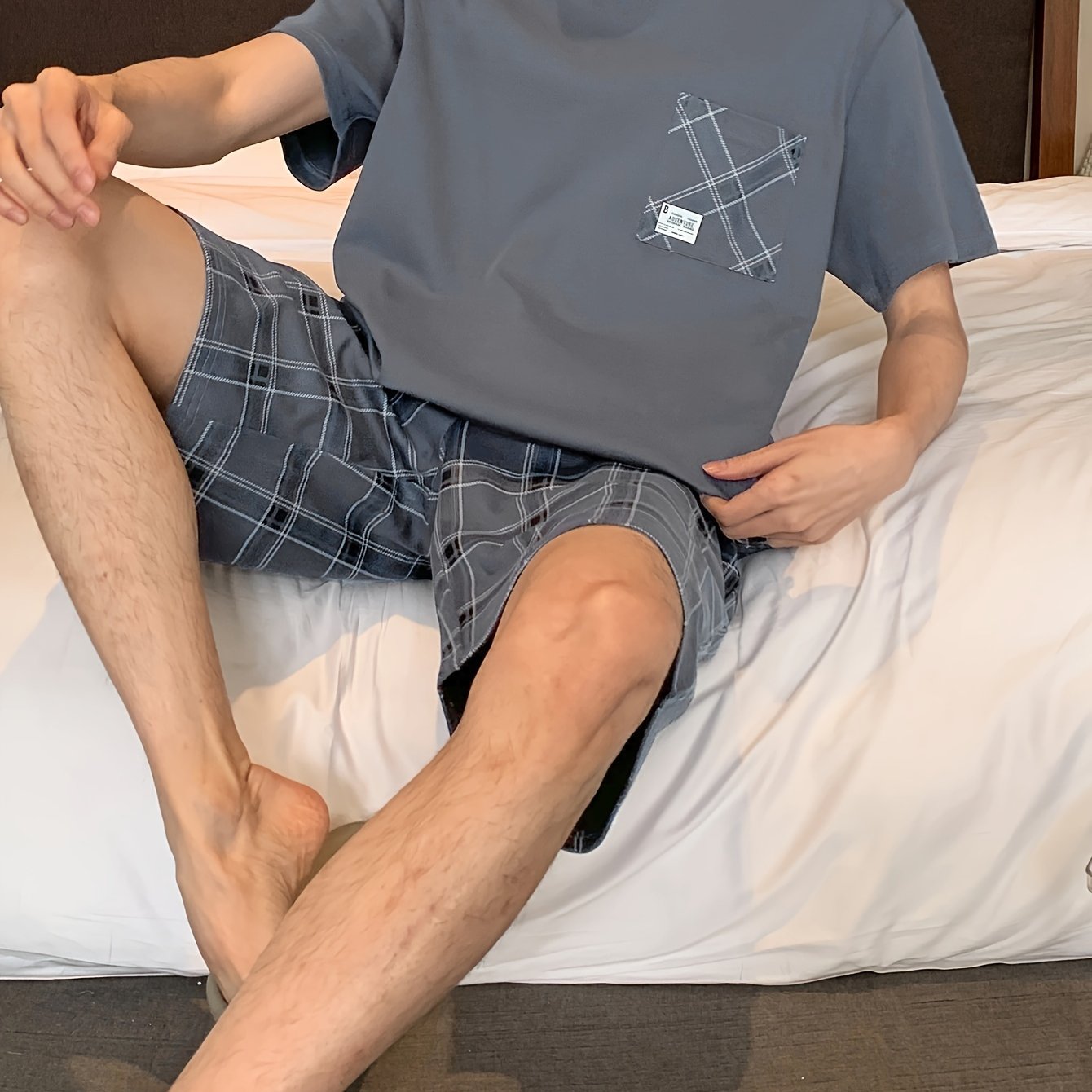 Men's stylish and comfortable 2-piece cotton pajama set with short sleeve top and shorts for lounging at home.