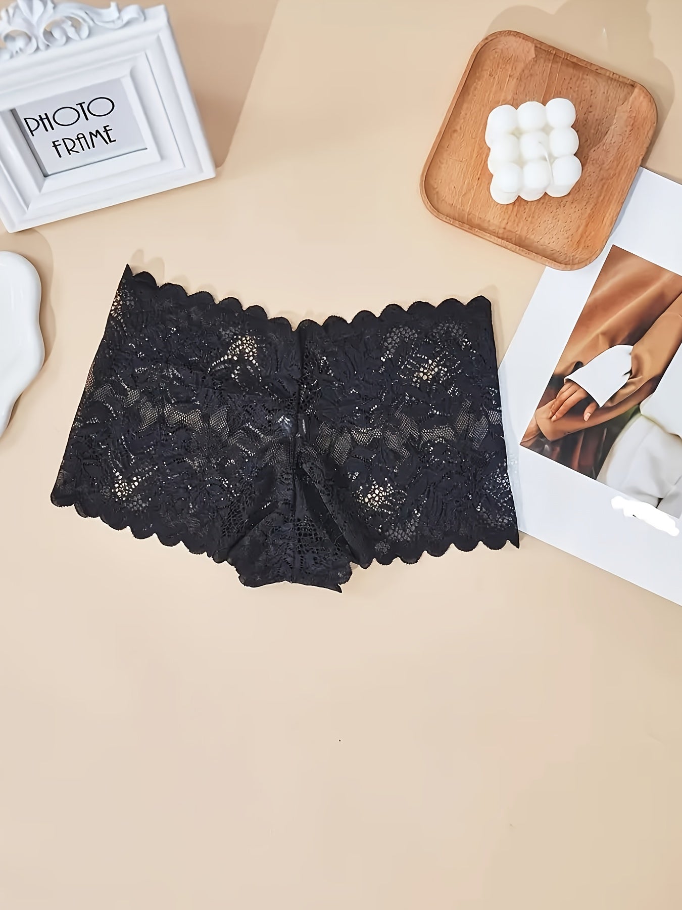 Sexy and comfortable lace boy shorts for women with floral pattern, low-rise, and breathable design. Nylon/elastane blend, hand washable.