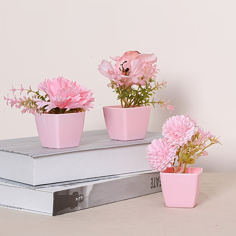 3-5 mini artificial potted pink flowers in plastic square pots, perfect for indoor décor on desks or bookshelves.