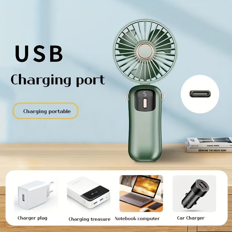 Sleek and stylish white and rose gold Compact & Portable USB Rechargeable Mini Fan with Neck Strap. Perfect for use in the office, classroom, or while traveling. Features a 1200mAh Lithium Battery, desk stand, and includes a power cable for convenient