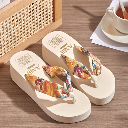 Floral print wedge flip flops with soft EVA sole, perfect for summer outings and holidays. Comfortable and stylish beachwear.