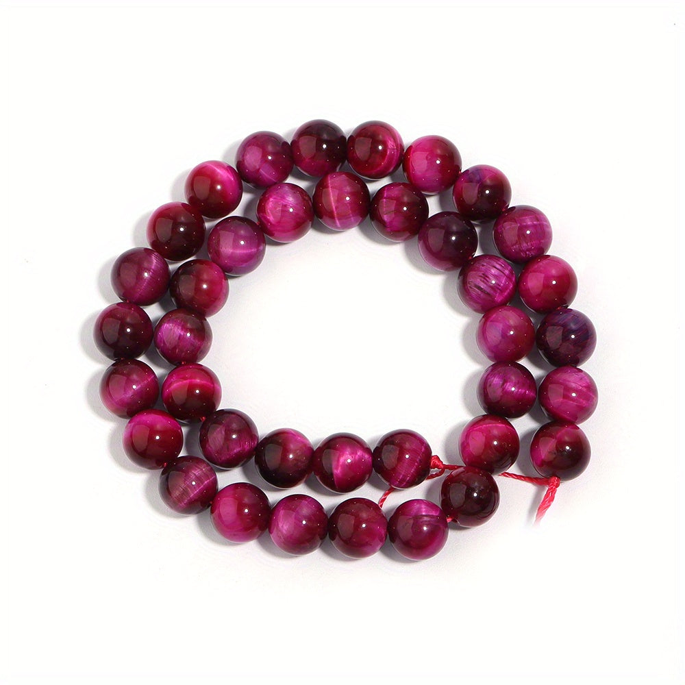 Smooth round beads of natural rose red Tiger's Eye in various sizes (4/6/8/10/12mm) for DIY jewelry making bracelets and necklaces.