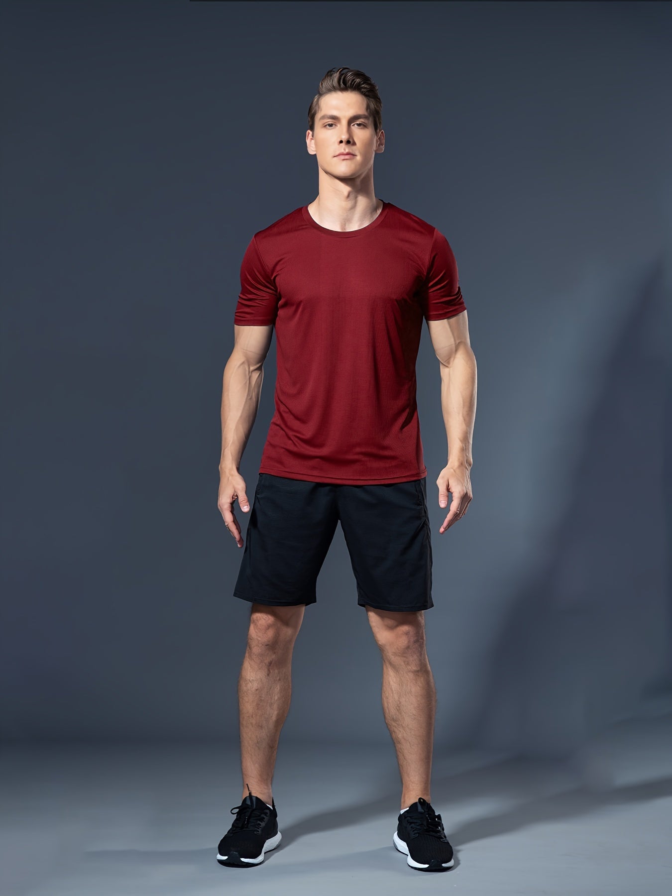 Summer men's fitness set includes white t-shirt and black shorts made of lightweight, quick-dry, breathable polyester for running, basketball training, and athletic wear.