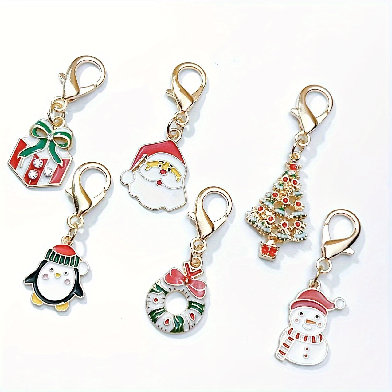 Six Christmas keychain charms made of zinc alloy with festive keyrings. These non-plated metal bag pendants are simple in style and perfect as holiday gifts for friends.