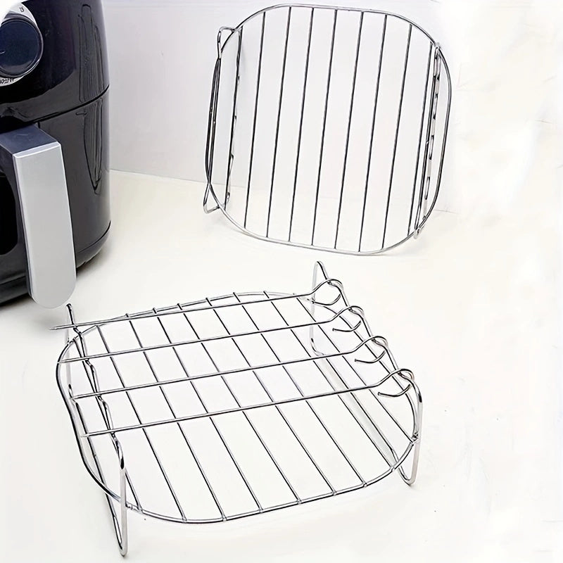 Set of stainless steel air fryer racks, featuring a round dual layer skewer holder. Compatible with most air fryers, these versatile roasting and grilling racks come with skewers for cooking and are safe for use in the dishwasher.