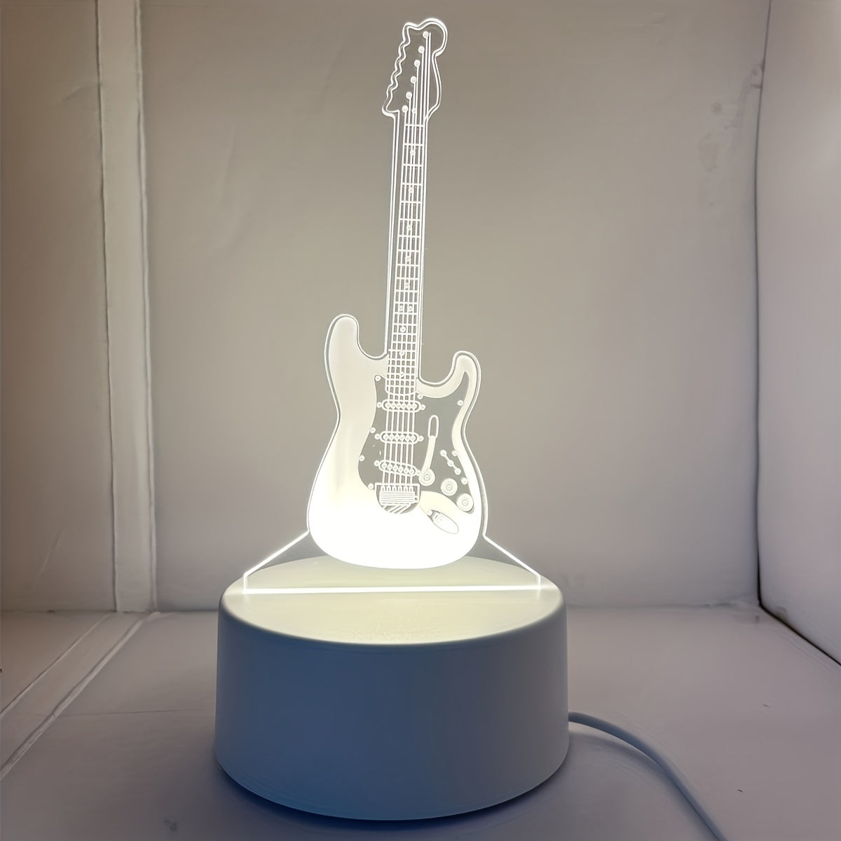 3D Guitar night light with warm white base, perfect gift for friends or room decoration.