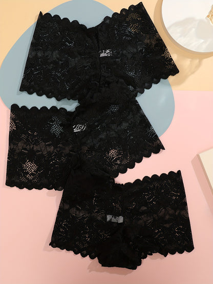 Set of three low-rise lace boyshort panties by FINETOO in black, white, and pinkish-beige floral patterns. Crafted from a breathable, stretchy nylon blend with scalloped trim.