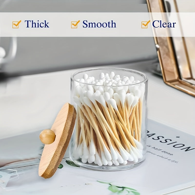 Qtip holder with bamboo lids for bathroom storage of swabs, balls, pads, and floss.