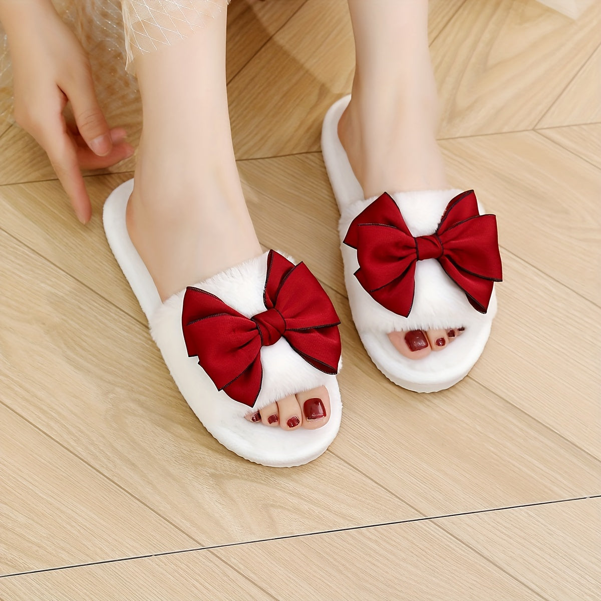 Fluffy home slippers with bowknot decoration, soft sole, non-slip, and cozy.