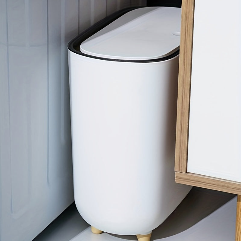 Slim plastic trash can with lid for small spaces, ideal for bedrooms, bathrooms, and living rooms.