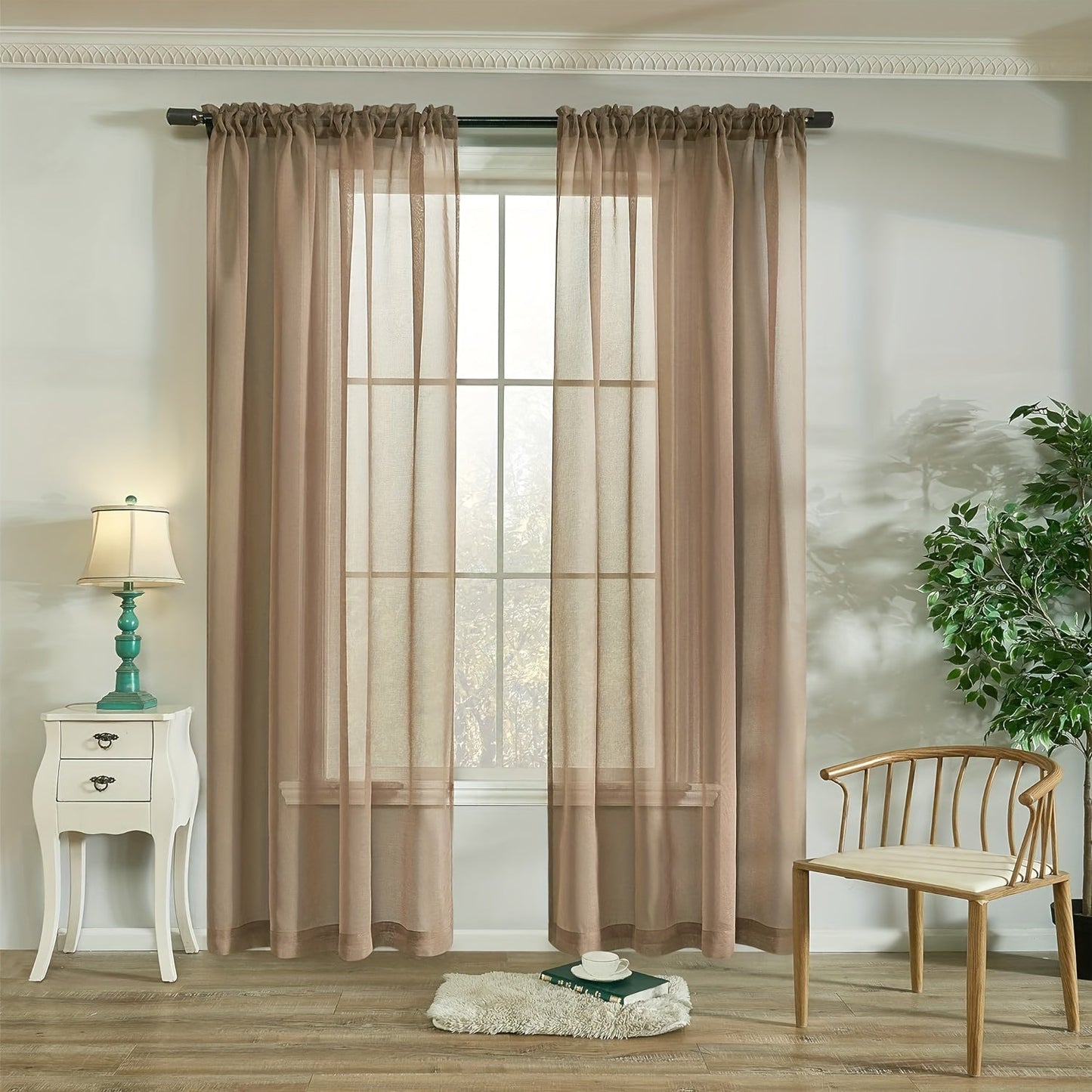 Two panels of sheer curtains with a basic rod pocket design, perfect for adding a touch of elegance to your bedroom, office, living room, yard, kitchen, or any other space in your home.