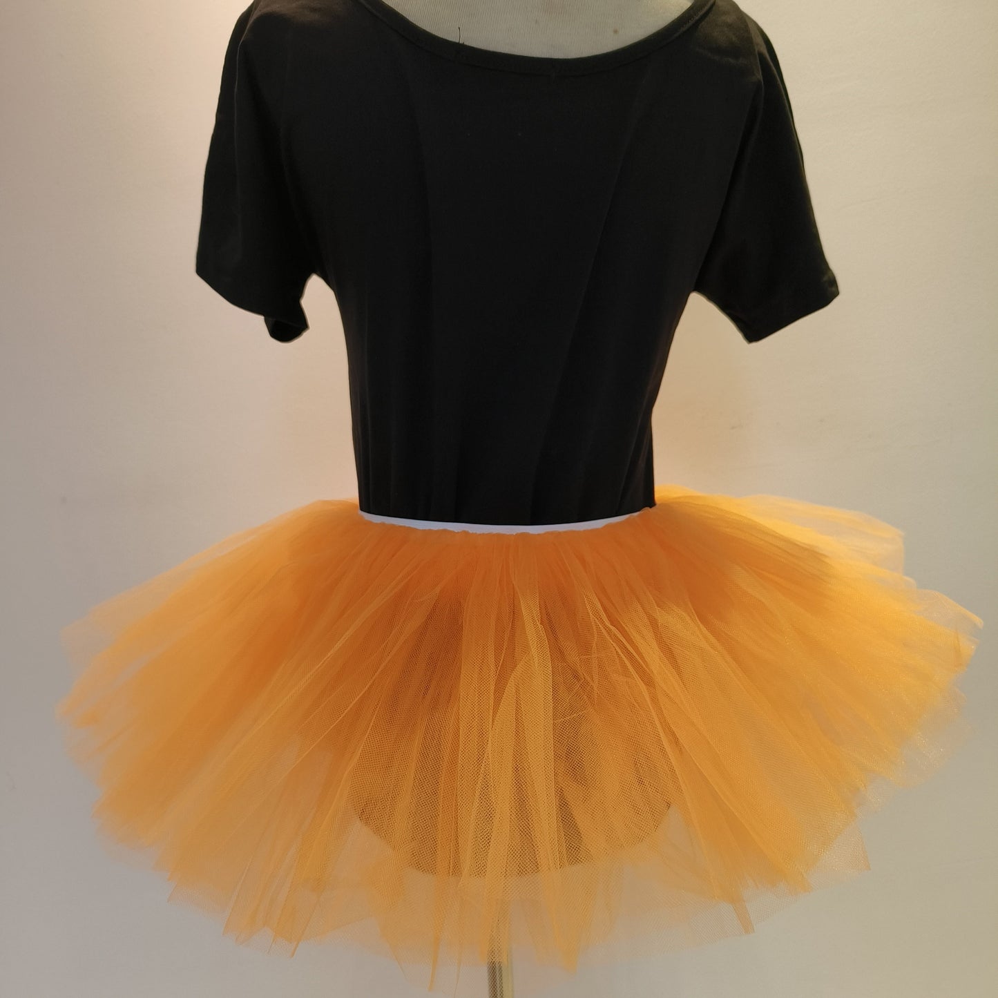 Get ready to party with this Fluffy 80s Tutu Skirt! Perfect for women and teens, this elastic waist skirt features 5 layers of tulle for an ultra-fluffy look. Ideal for Halloween, costume parties, and holiday festivities like Christmas.