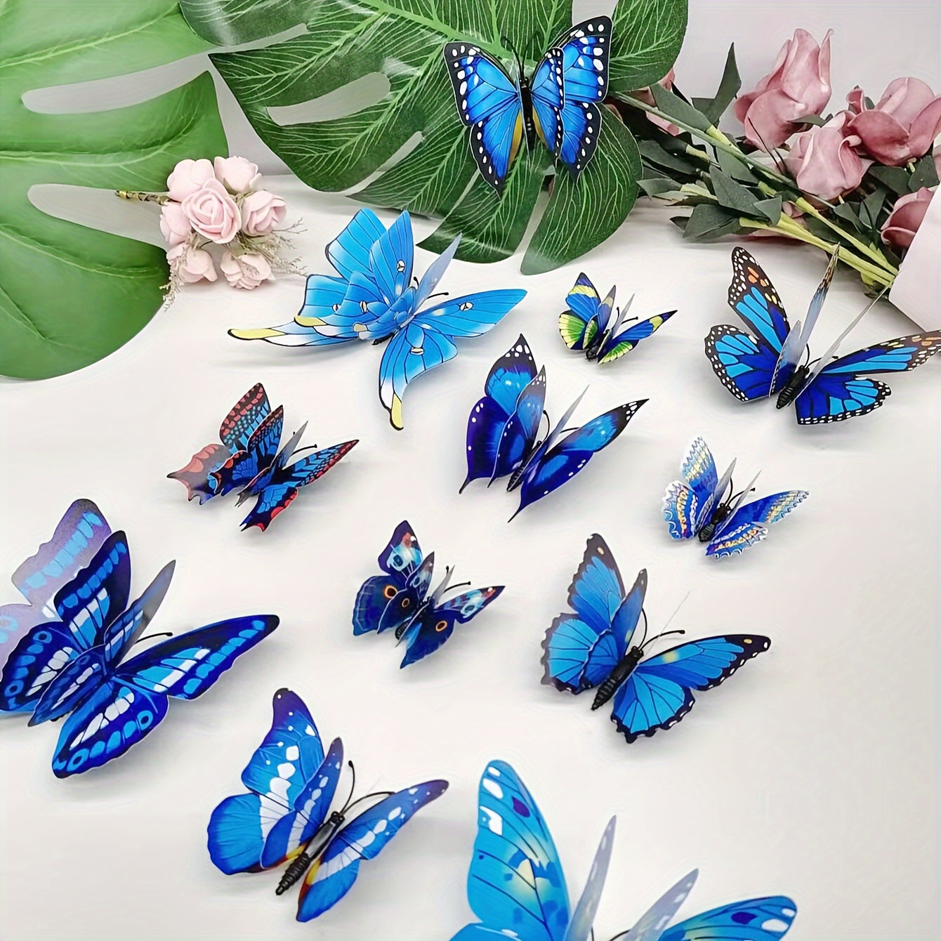 12pcs of vibrant 3D butterfly wall decals in blue shades, double-layer design, removable and self-adhesive stickers for home decor, parties, and weddings. Made of paper, these butterfly decorations are perfect for adding a touch of nature to your living