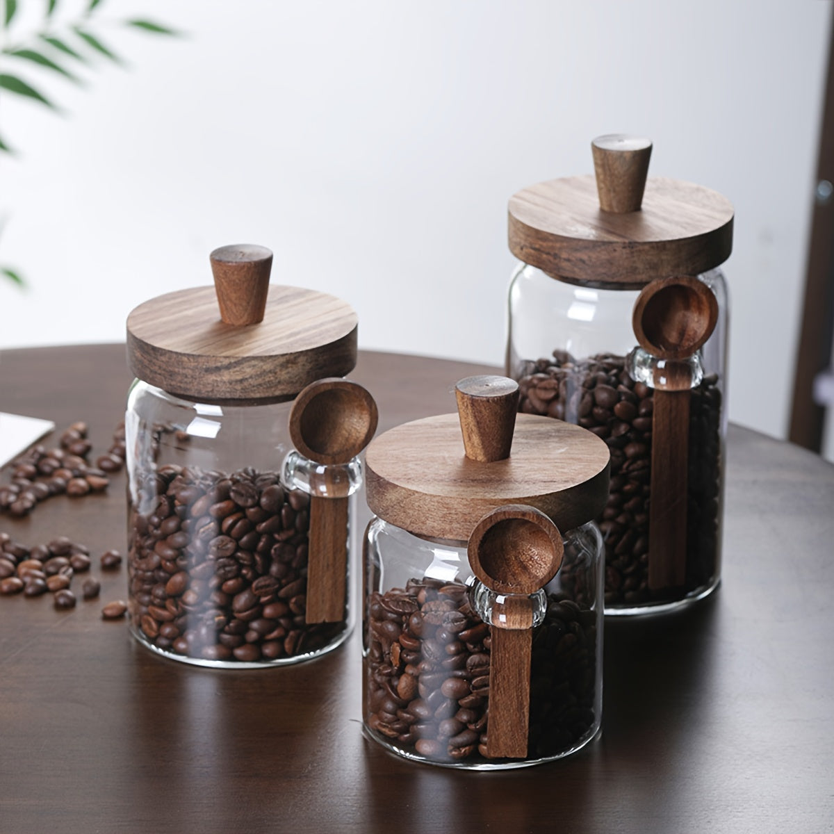 Glass containers for storing coffee, tea, grains, snacks, and pickles.