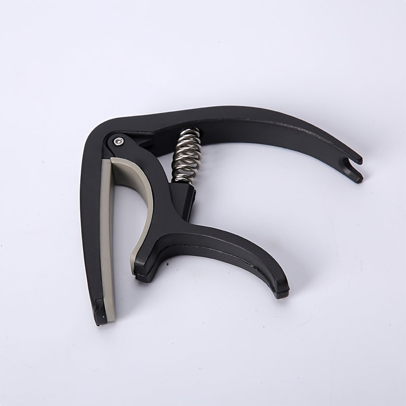 Nylon guitar capo for easy tone adjustment on acoustic, classic, electric guitars, and ukuleles.