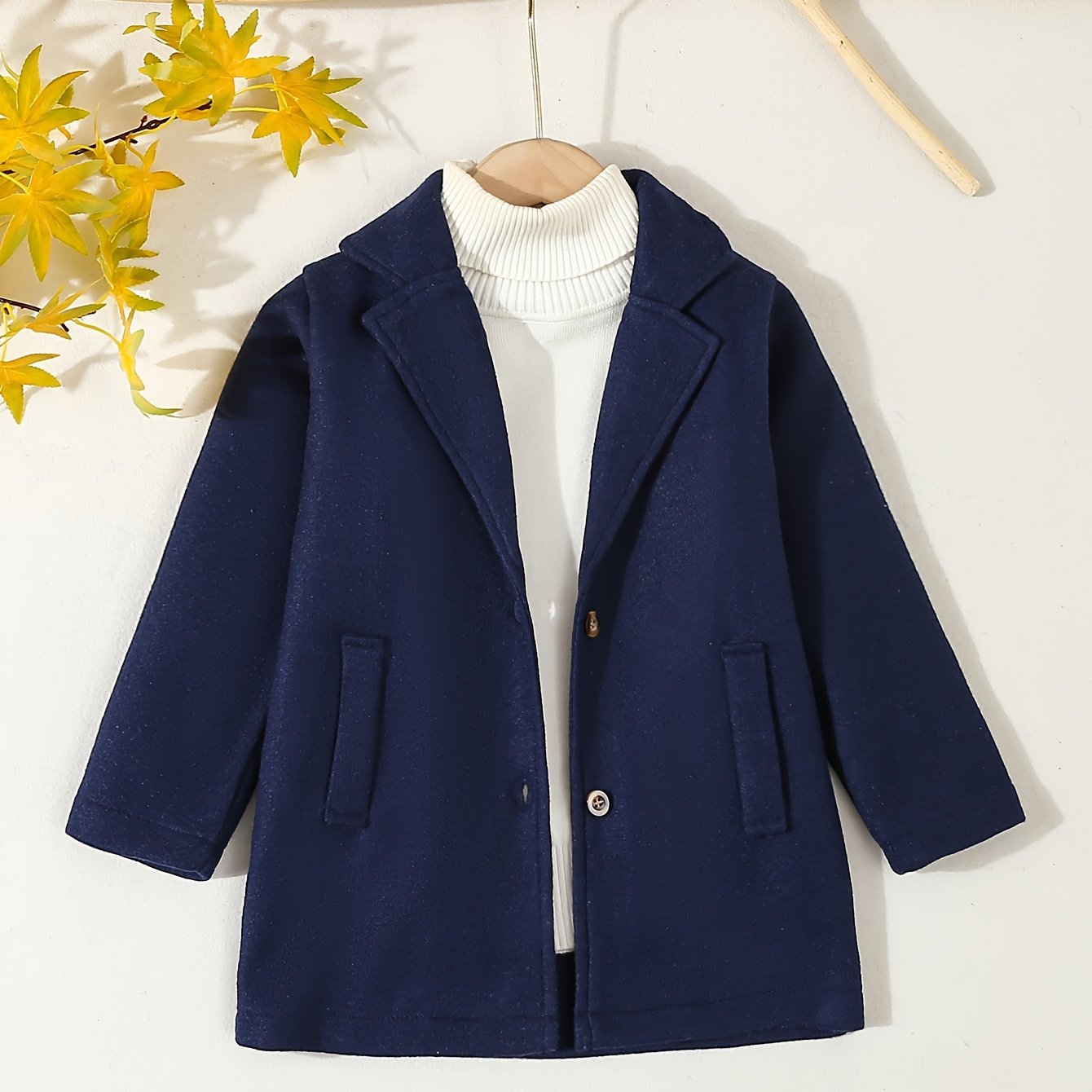 Boys' preppy coat with lapel collar, fake pockets, and button closure. Made of polyester for spring/fall. Fits ages 12 and under.