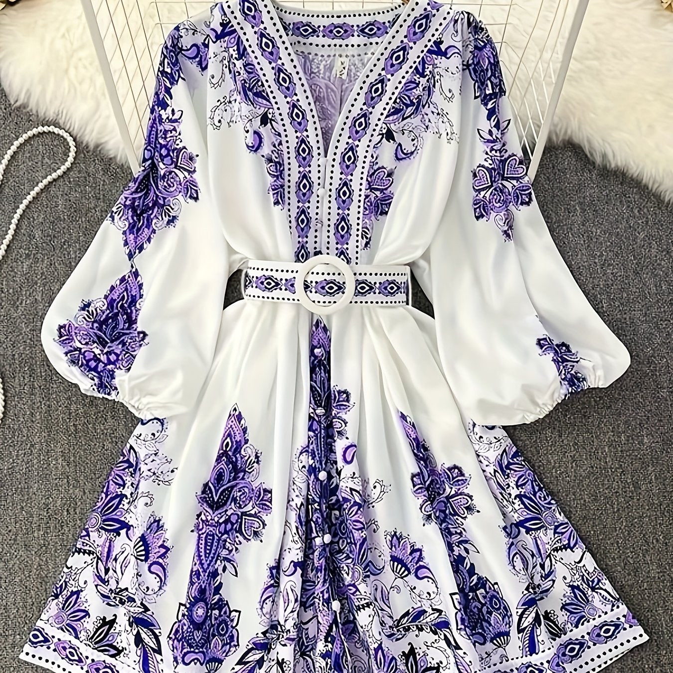 Bohemian floral print midi dress with belt, perfect for summer vacations and casual wear. Made of lightweight polyester with a V-neck and half sleeves.