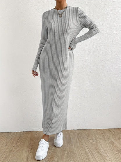 Elegant crew neck striped knit t-shirt dress made from a polyester and spandex blend. Features long sleeves and full-length ribbed knitwear for spring/fall.