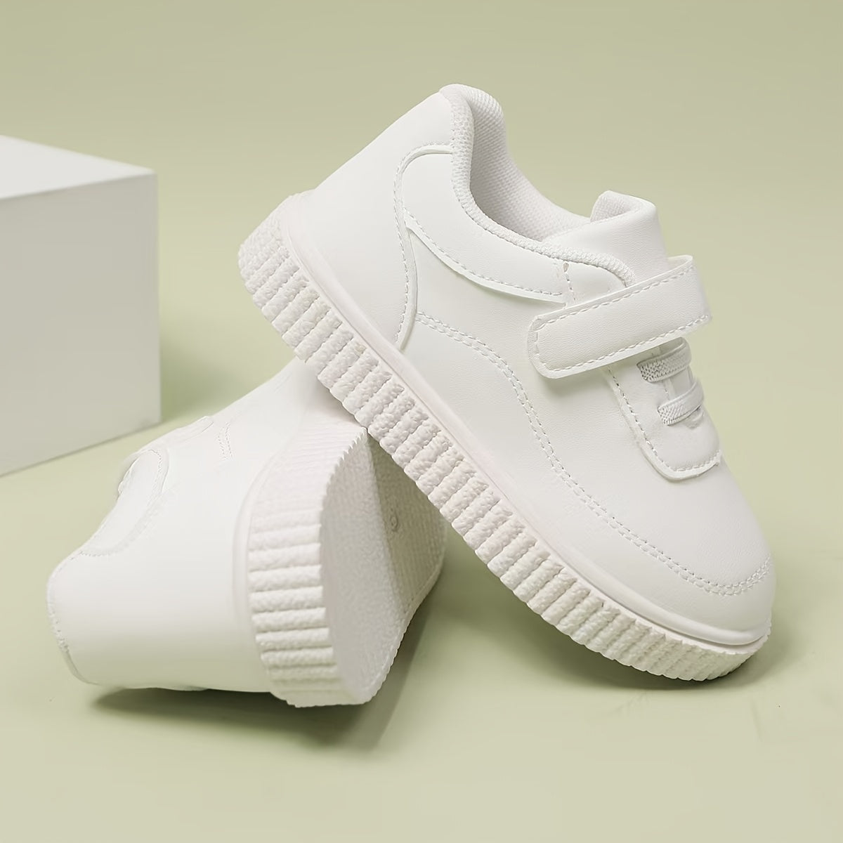 Kids White Sneakers - Lightweight sports shoes with Bullock detail, stylish and versatile for boys and girls under 14.