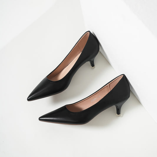 Stylish black mid-heel pumps with pointed stiletto heels, faux leather, rubber sole, lightweight - available in sizes 34-43.