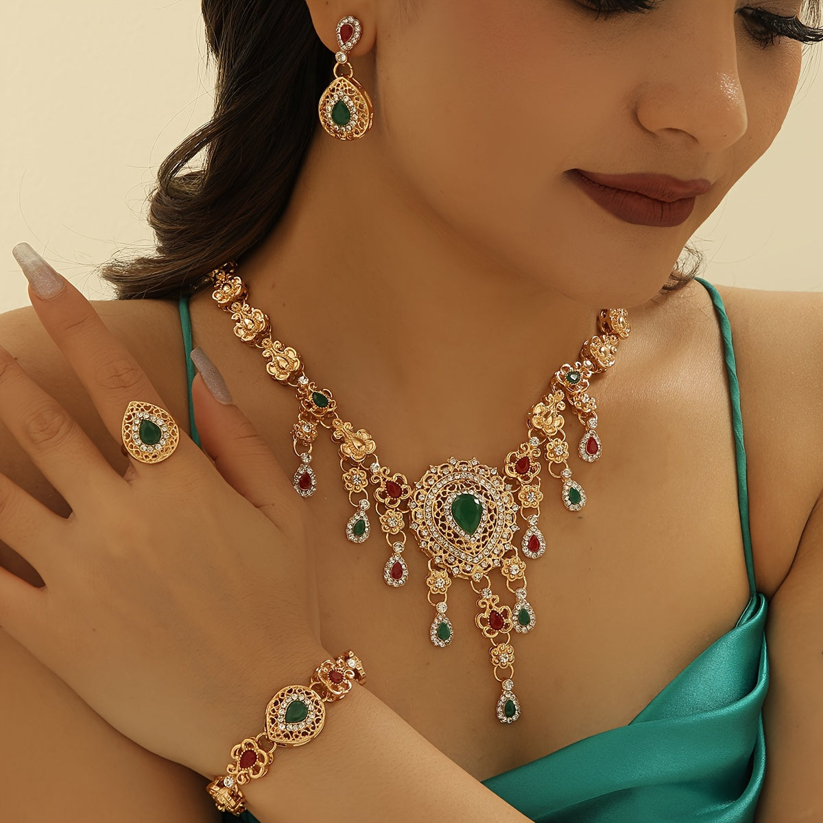 This exquisite 5-piece jewelry set boasts a luxurious vintage Middle Eastern style, complete with vibrant rhinestone drop pendants. Including a necklace, earrings, ring, and bracelet all crafted from Zinc Alloy, this set is the perfect accessory for