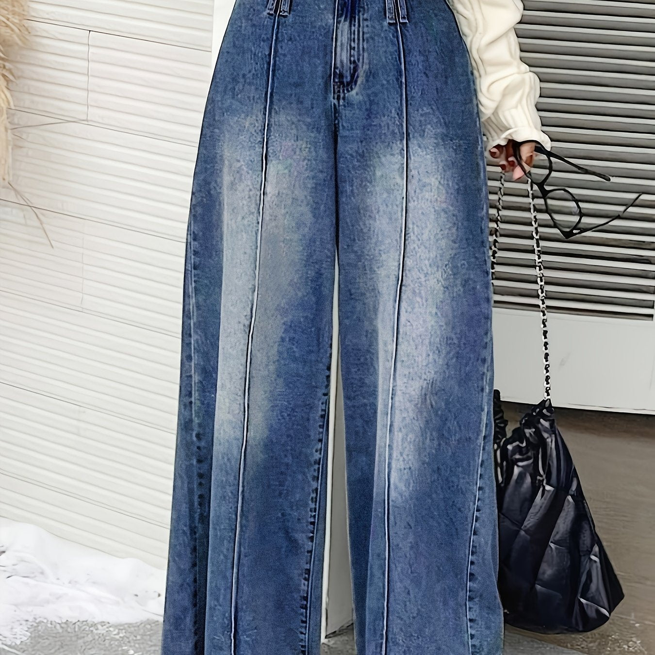 Women's wide-leg denim jeans with elastic waistband, loose fit, mid-rise, and slash pockets in light to dark blue gradient.