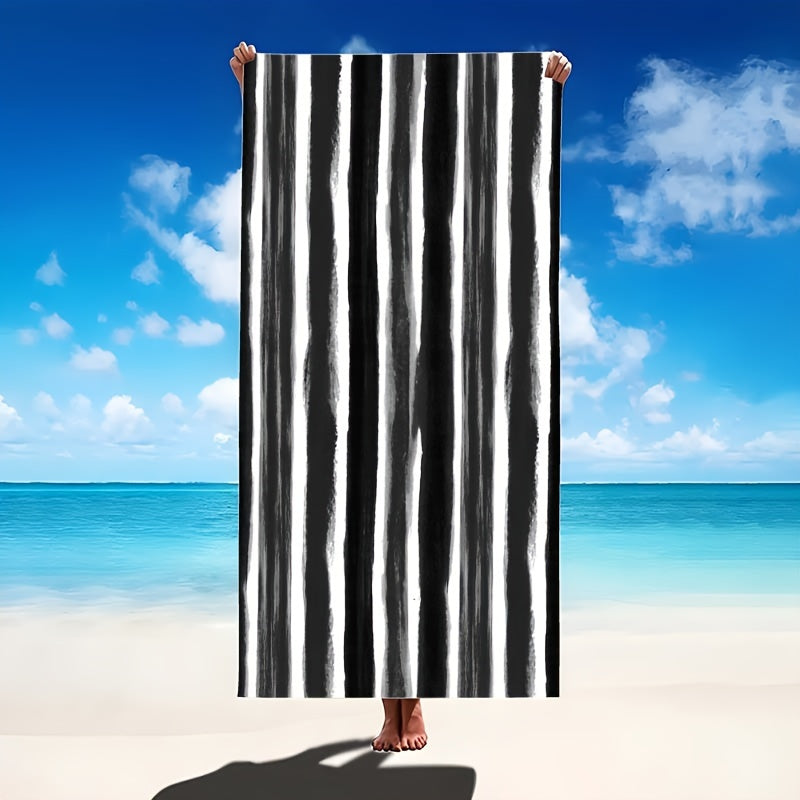 Oversized striped beach towel perfect for adventures. Made of super soft microfiber, quick-dry, sand-free, and ideal for various activities. Available in tropical blue & white. Comes in two sizes and is lightweight and absorbent.