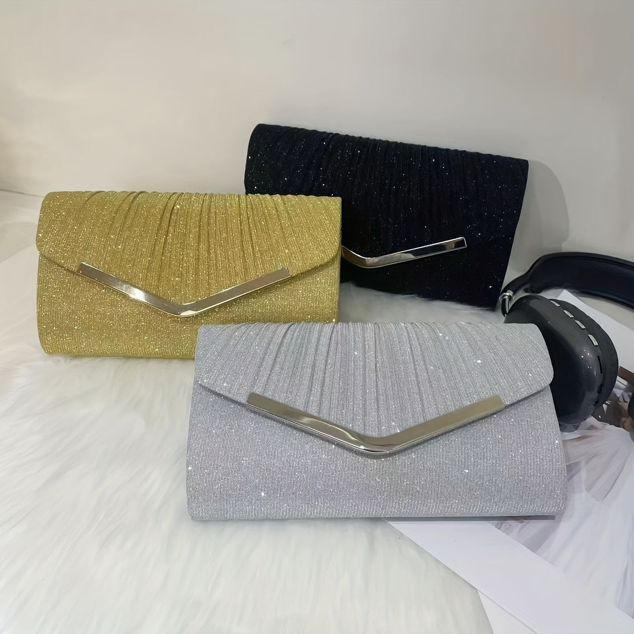 A dazzling envelope clutch adorned with gold accents, ideal for chic women at weddings and parties.