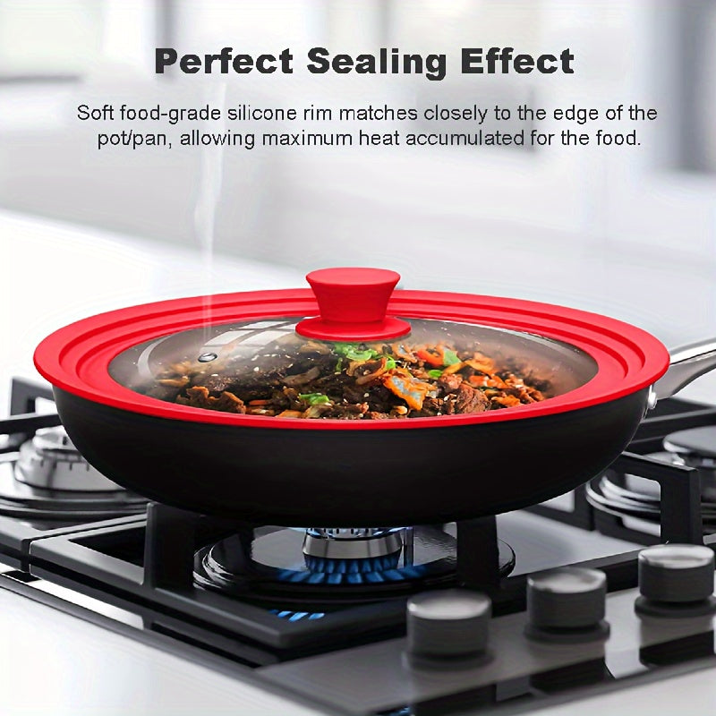 Multi-functional red silicone-rimmed glass lid designed for pots and skillets from 20.32cm to 27.94cm in diameter - can be safely cleaned in the dishwasher, features a non-slip knob, and is heat resistant.