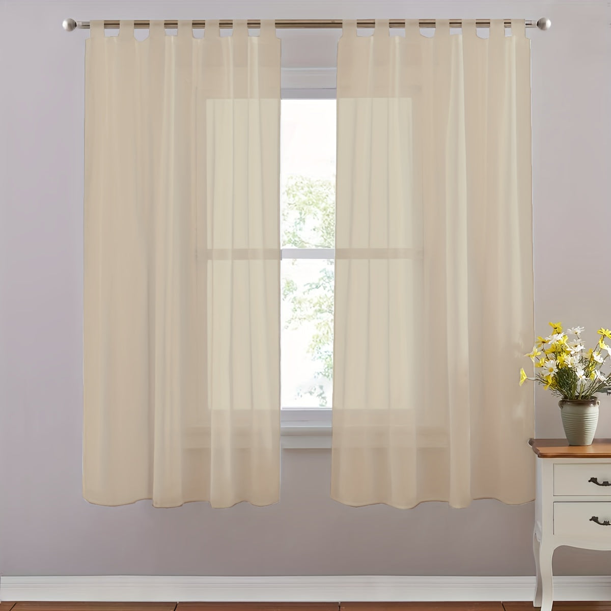 Set of 2 lightweight solid white sheer curtains with tab tops, perfect for bedroom, living room, and dining room. Includes 2 pieces.