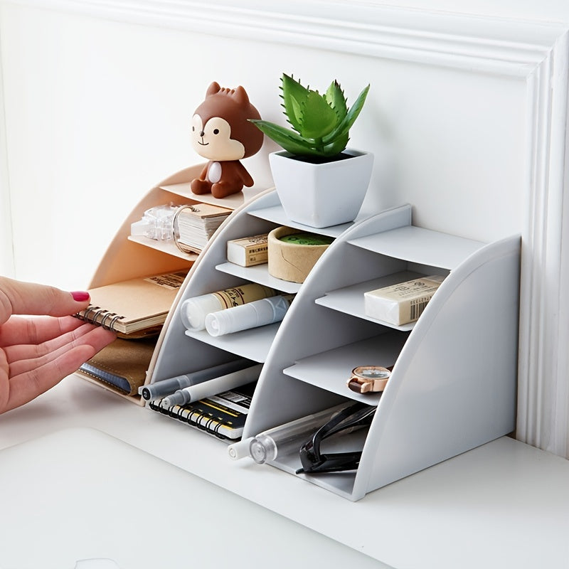 Pocket folder with grid remote control box for organizing cosmetics on desktop.