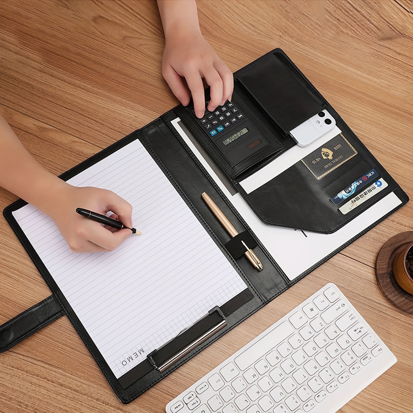 Multipurpose leather portfolio folder for interviews and meetings, includes legal pad, clipboard, pen holder, business card slots, phone and calculator pouches.