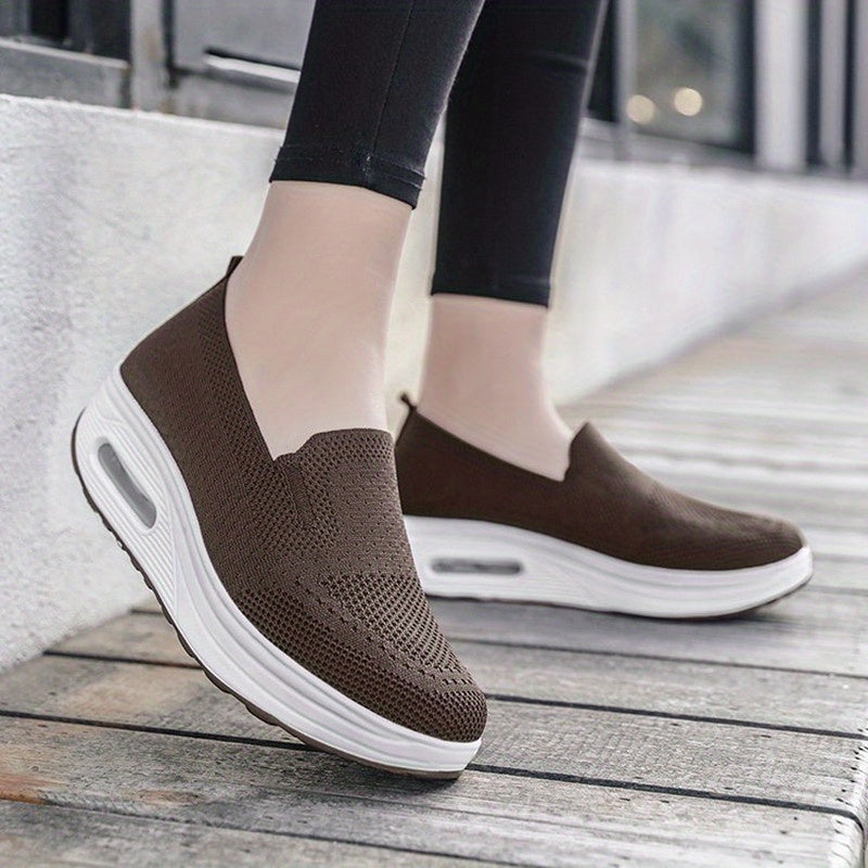 Women's slip-on sneakers from the Spring Collection in solid colors of black, light gray, pink, and dark blue. Features breathable knit fabric, air cushion sole, and low-top design for